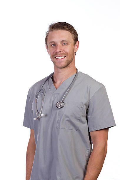 istock Man in Grey Scrubs Smiles Vertical 187162908