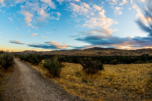 Beautiful sunrise over Boise hills in Boise, Idaho with Oregon Trail in the foreground. Picture taken with 16 mm fish-eye lens
