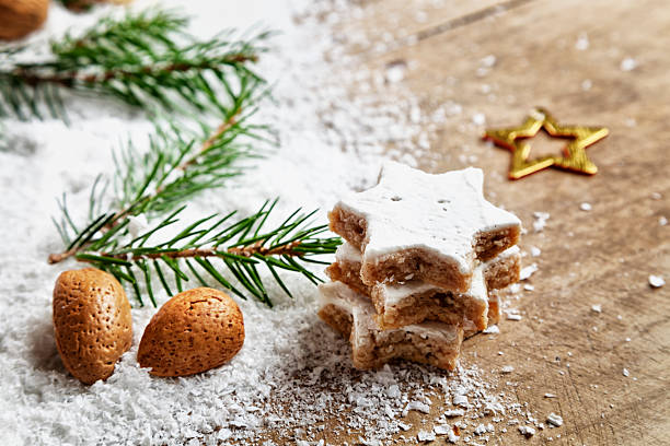 istock christmas cookie and almond on snow wood 187163466