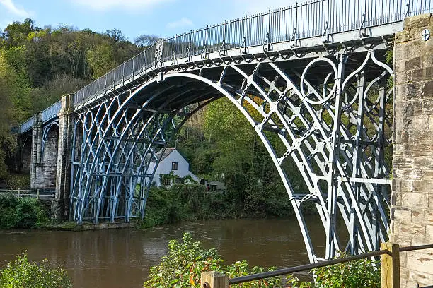 The bridge known as Ironbridge in the village of Ironbridge in Shropshire, UK.  The bridge was built in 1779 and spans the River Severn at a maximum height of 30 metres (100 ft)