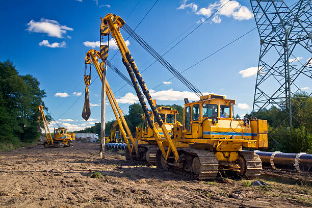 Construction of a gas pipeline Construction machinery on the pipeline construction crane machinery photos stock pictures, royalty-free photos & images