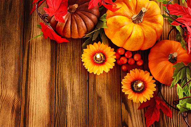 istock Autumn decoration with candle, maple leaves and pumpkins 187164824