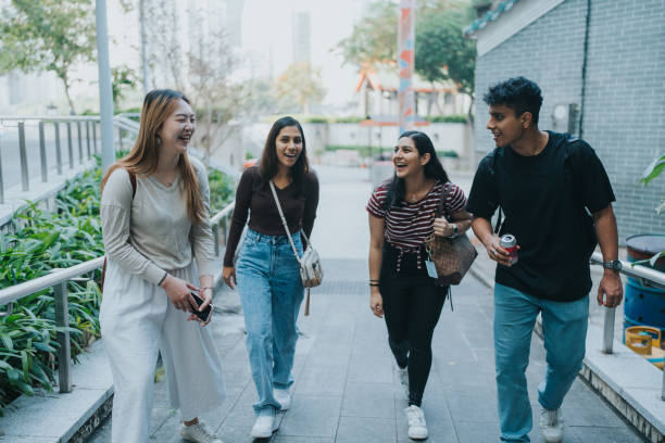 istock A group of tourists (young adults) talking and laughing with each other 1871662801