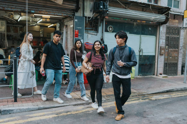 istock A group of multicultural tourists crossing the road 1871662834