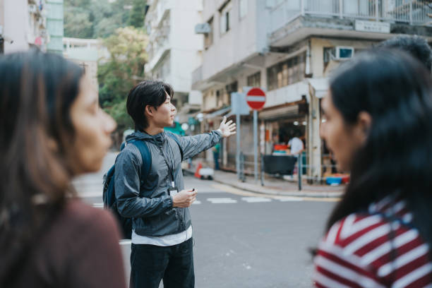 istock A Chinese male tour guide showing directions 1871662847