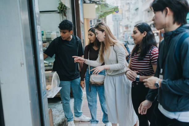 istock A group of multicultural tourists looking excitedly at a bakery shop 1871663373