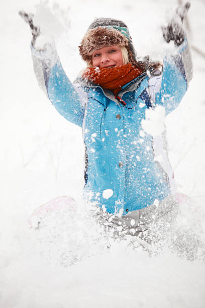istock Young woman having fun in snow 187166580
