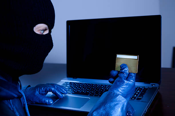 istock Crime:  Cyber crimes. Thief steals credit card information. 187166994