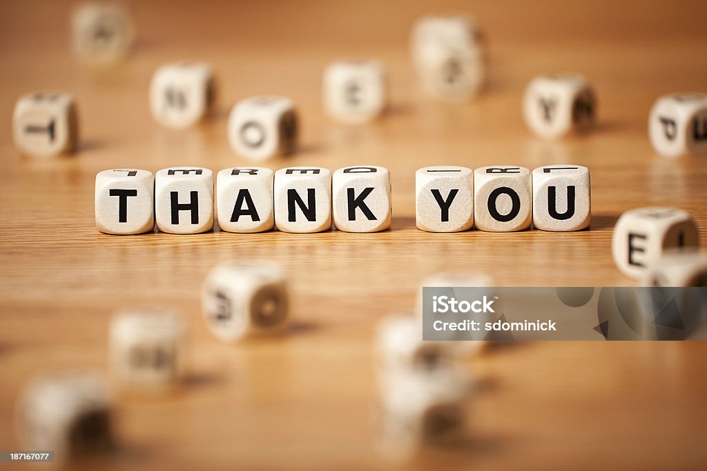 The Phrase THANK YOU Spelled In Letter Cubes The phrase THANK YOU spelled in letter cubes. Block Shape Stock Photo