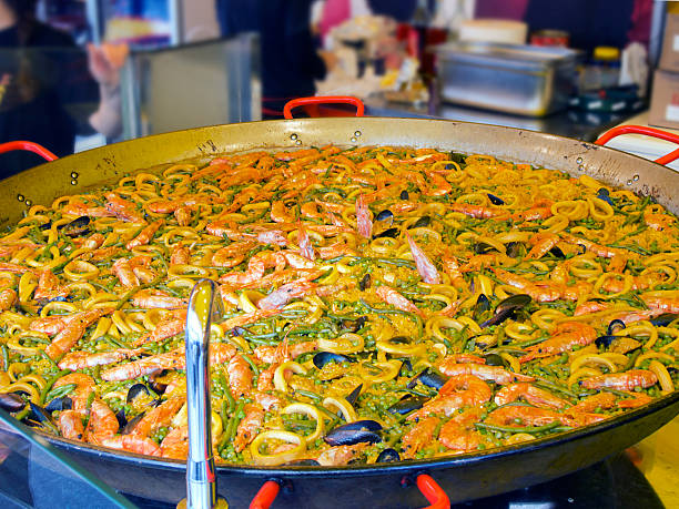 great  Spanish  paella pan squid and vegetables stock photo