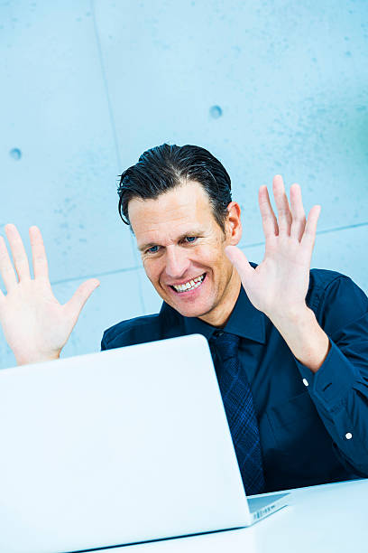 istock Businessman greeting in video conference 187167620