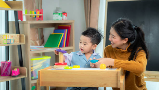 Asian boy fun and watching cartoon video in he computer notebook stock photo