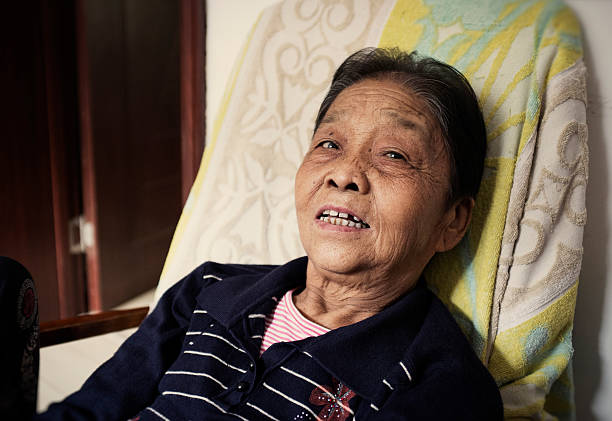 istock My grandmother resting on the couch 187167931