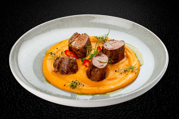 istock Pork loin on mashed yams. Isolated image 1871685670