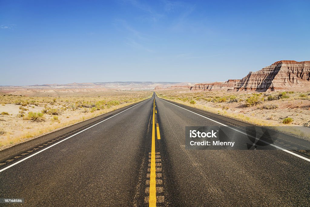American Highway through Arizona Highway through the rocky desert landscape close to the border between Arizona and Utah, USA. Arizona Stock Photo