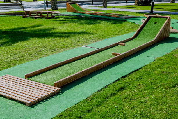 istock Mini golf court on the grounds, on green grass in sunny day 1871689882