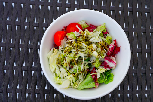 Portion of mix salad - cheese, carrots, beans, Lettice, chickpeas, zucchini, Slovenia.