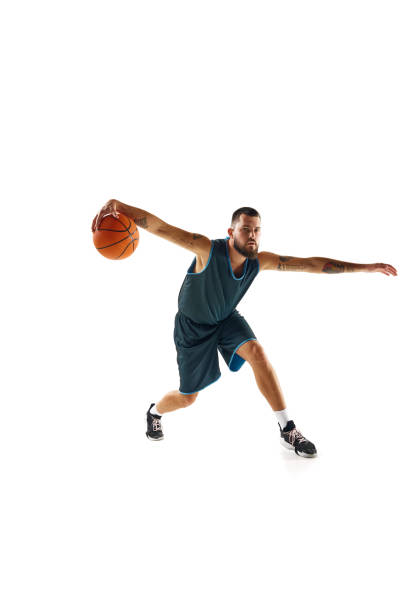 istock Professional sportsman in uniform, engaged in focused training session before match against clean white background. 1871697185