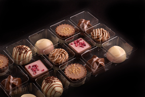 photo presents a mouthwatering assortment of chocolatesa sweet symphony of flavors and textures. With a tempting variety of bonbons, this delightful treat is perfect for indulging on Valentine's Day or any occasion.