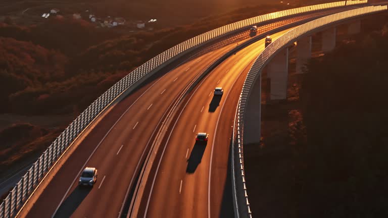 AERIAL Drone Shot of Vehicles Driving on Longest Viaduct at Sunset in Slovenia