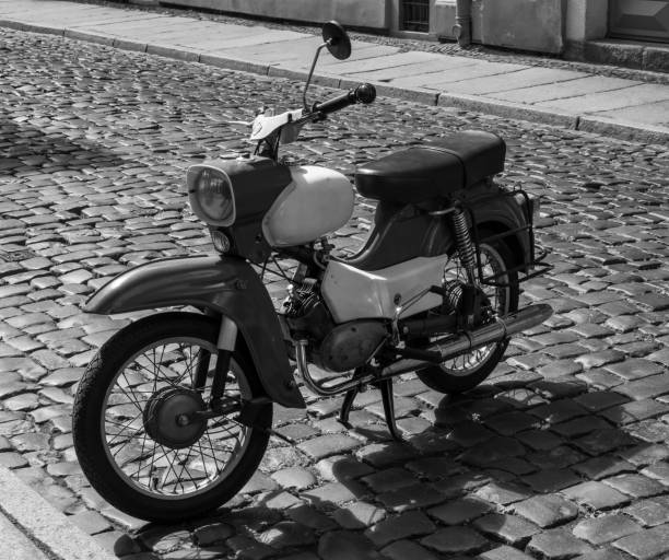 istock vintage scooter parked in the street 1871704367