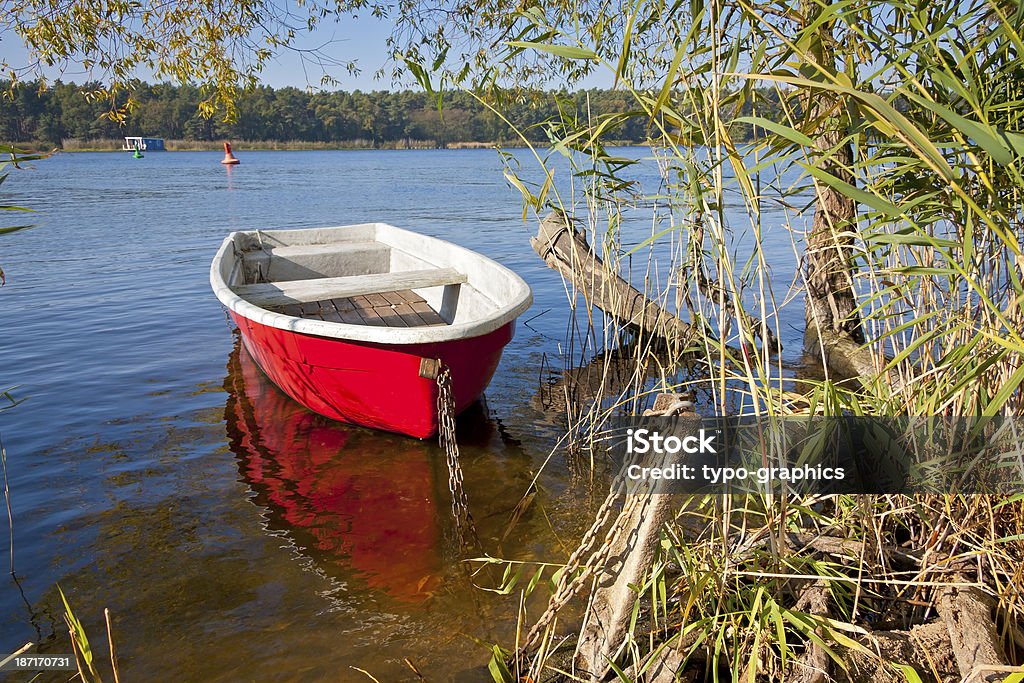 Red Rowboat Red Rowboat on the bank of the river Havel. (Was seen in Brandenburg, in the Havelland near Pritzerbe). Beauty In Nature Stock Photo
