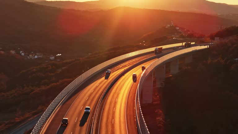 AERIAL Drone Shot of Motor Vehicles Driving on Longest And Highest Viaduct at Sunset in Slovenia