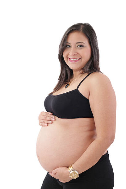 istock Young pregnant woman smiling at camera 187171267