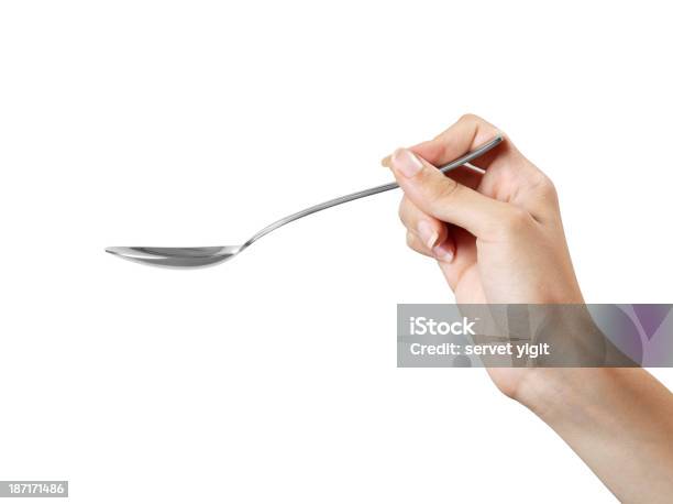 Female Hand Holding Spoon Stock Photo - Download Image Now - Spoon, Human Hand, Tablespoon