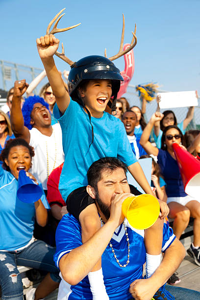 istock Sports: Fans cheer for their team during local sporting event. 187174065