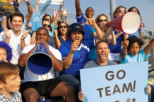 istock Sports: Fans cheer for their team during local sporting event. 187174069