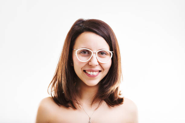 Smiling woman with fashionable glasses exudes approachability and charm