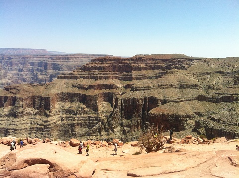Visitors hike Grand Canyon in wide angle shot from camera, Tourists on Grand Canyon in June, 2015, United State