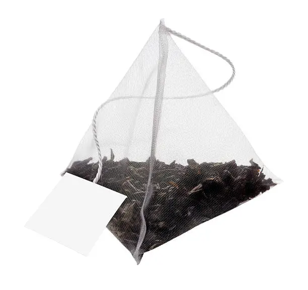 Teabag as a pyramid, isolated on white background clipping path included