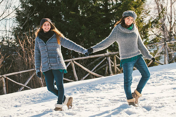 istock Girls are having fun with the snow 187175209