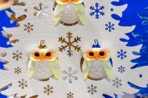 White plywood decorative Christmas tree with owls