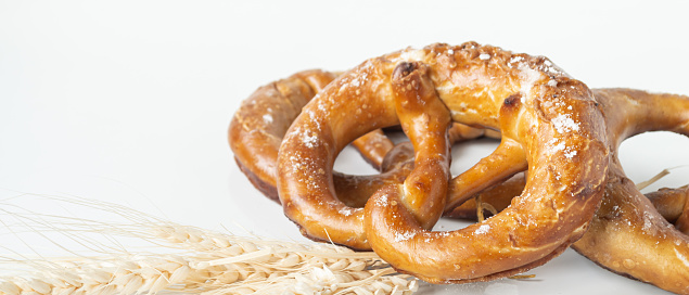 Freshly Baked Brown and Salty Pretzels on a white background