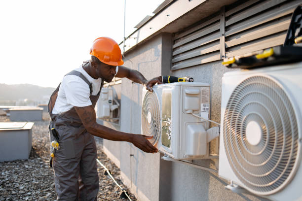 istock African man in uniform checking air conditioner on plant 1871801732