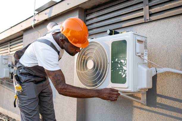 istock Male master fixing conditioner and checking fan outdoors 1871801744