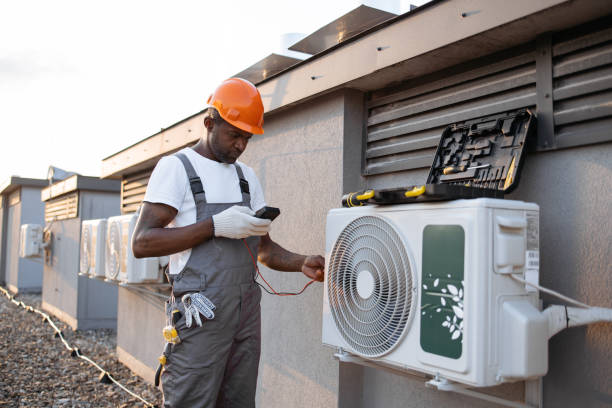 istock Busy repairman checking voltage level in air conditioner 1871801794