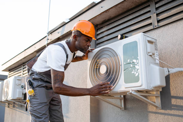 istock Male master fixing conditioner and checking fan outdoors 1871801882