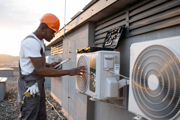istock Male holding tablet and installing cooling system outdoors 1871802310