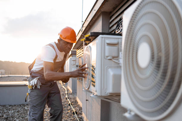 istock Male holding tablet and installing cooling system outdoors 1871802313