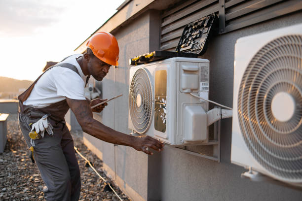 istock Male holding tablet and installing cooling system outdoors 1871802316