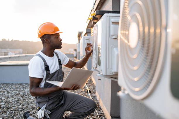 istock Man repairing device for cooling with laptop in hands 1871802322