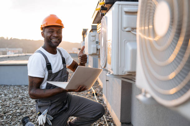 istock Man repairing device for cooling with laptop in hands 1871802325