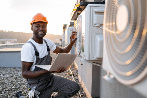 istock Man repairing device for cooling with laptop in hands 1871802327