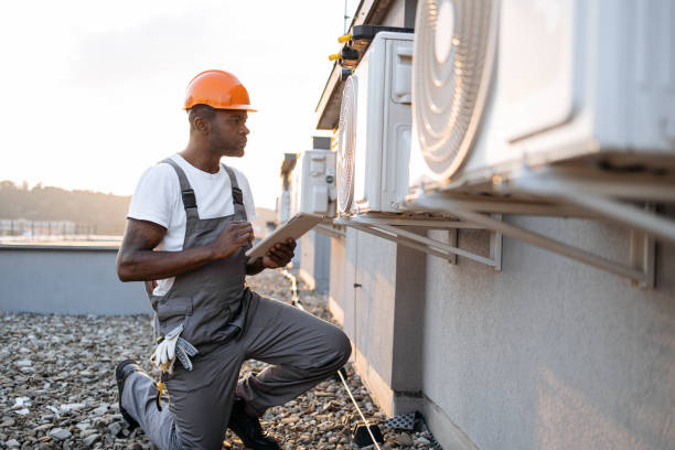 istock Man in uniform using digital tablet for air conditioners 1871802329