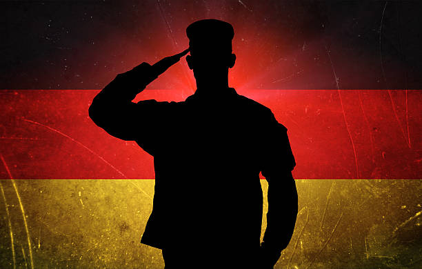 istock Proud male soldier on german flag background 187180404