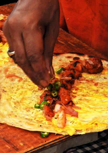 istock view of Indian stret vendor making vegetarian spring rolls 1871805995